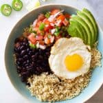 Quinoa Breakfast Bowl in a blue bowl with text overlay.