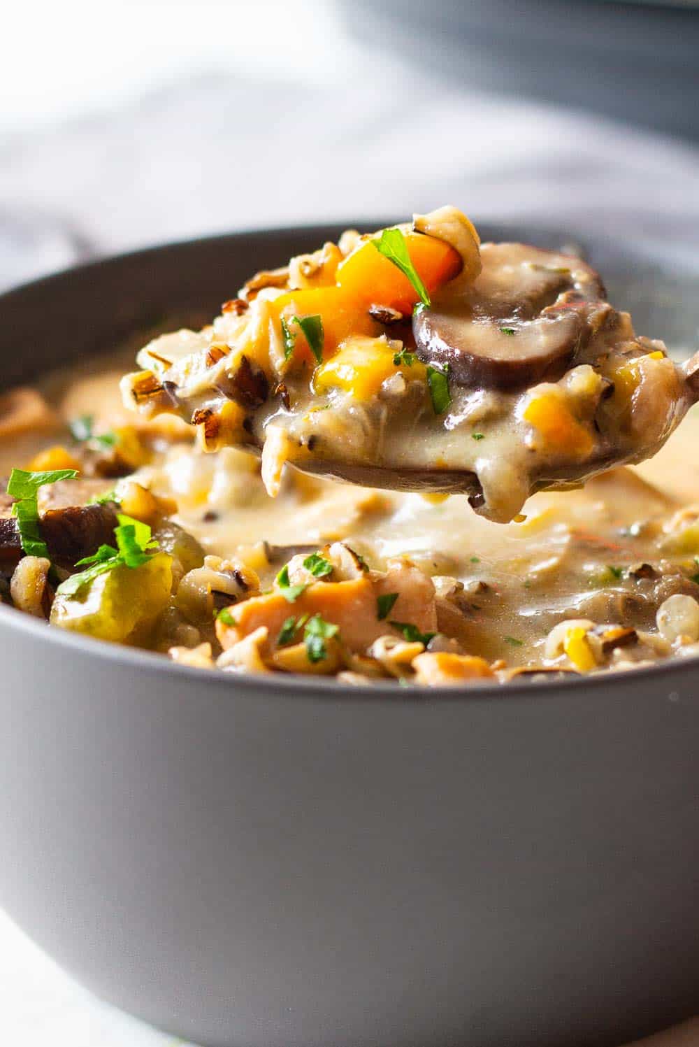 Instant Pot Chicken Wild Rice Soup served in a grey bowl.