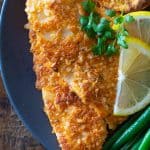 Breaded sole fish fillet on a plate.